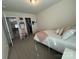 Comfortable bedroom with a twin bed, carpeting, and access to closet and hallway at 1016 Laggan Ln, Indian Trail, NC 28079