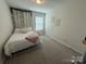 Bright bedroom featuring a twin bed, carpeting, and natural light from a window at 1016 Laggan Ln, Indian Trail, NC 28079