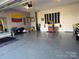 Well-organized garage with a clean epoxy floor and ample space for storage and recreation at 1016 Laggan Ln, Indian Trail, NC 28079