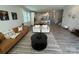 Cozy living room showcasing hardwood floors, a modern rug, and an open floor plan at 1016 Laggan Ln, Indian Trail, NC 28079