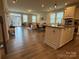 Open concept living area featuring a modern kitchen, dining space, and comfortable seating area at 1016 Laggan Ln, Indian Trail, NC 28079
