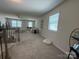Bright living room with plush carpeting and comfortable seating arrangements near bright windows at 1016 Laggan Ln, Indian Trail, NC 28079