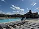 Community pool with lounge chairs and clubhouse, offering a relaxing and social atmosphere at 1016 Laggan Ln, Indian Trail, NC 28079