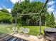 Inviting backyard patio with stylish seating under a pergola, perfect for outdoor entertaining at 10639 Secret Garden Ln, Charlotte, NC 28214