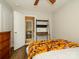 Cozy bedroom with a functional desk area and a view into a separate room with open shelving at 10639 Secret Garden Ln, Charlotte, NC 28214