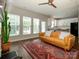 Inviting living room with hardwood floors, leading into a modern kitchen, bathed in natural light at 10639 Secret Garden Ln, Charlotte, NC 28214