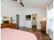 Cozy main bedroom with modern furnishings and an en-suite bathroom at 10639 Secret Garden Ln, Charlotte, NC 28214