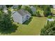 Aerial view of the back of the house and backyard showing lawn and fencing at 1111 Balcorn Pl, Charlotte, NC 28214