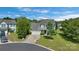 Aerial view of a home, showcasing its landscaping, driveway, and neighborhood at 1111 Balcorn Pl, Charlotte, NC 28214