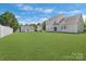 Spacious fenced backyard with lush lawn and patio, perfect for entertaining at 1111 Balcorn Pl, Charlotte, NC 28214