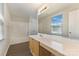 Bathroom with white tub and shower, light wood vanity, and large mirror at 1111 Balcorn Pl, Charlotte, NC 28214