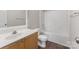 Bathroom features a combination tub and shower, vanity, framed mirror, and wood look vinyl flooring at 1111 Balcorn Pl, Charlotte, NC 28214