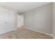 Bedroom with double closet, carpet floors and ensuite bathroom at 1111 Balcorn Pl, Charlotte, NC 28214