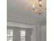 Bright interior area with an ornate chandelier, windows, and ample natural light at 1111 Balcorn Pl, Charlotte, NC 28214