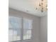 Elegant chandelier and windows creating a bright and inviting atmosphere at 1111 Balcorn Pl, Charlotte, NC 28214