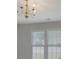 Classic chandelier fixture with multiple windows allowing lots of natural light at 1111 Balcorn Pl, Charlotte, NC 28214