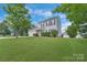 Charming two-story home featuring a well-manicured lawn and inviting curb appeal at 1111 Balcorn Pl, Charlotte, NC 28214