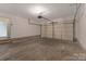 Spacious two car garage featuring painted walls and concrete flooring at 1111 Balcorn Pl, Charlotte, NC 28214