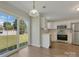 Inviting eat-in kitchen with stainless appliances, light cabinets, and sliding glass doors to the backyard at 1111 Balcorn Pl, Charlotte, NC 28214