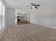 Open concept living room with neutral carpet and adjoined kitchen space at 1111 Balcorn Pl, Charlotte, NC 28214