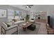 Bright living room featuring contemporary furnishings, neutral decor, and a seamless open-concept design at 1111 Balcorn Pl, Charlotte, NC 28214