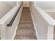 Carpeted stairway with handrail leads to the next level of this beautiful home at 1111 Balcorn Pl, Charlotte, NC 28214