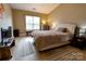 Spacious bedroom featuring neutral color scheme and soft, natural light through window at 11867 Ridgeway Park Dr, Charlotte, NC 28277