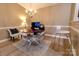 Cozy dining area features a chandelier and a stylish table set for a meal with barstool seating at 11867 Ridgeway Park Dr, Charlotte, NC 28277