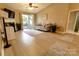 Inviting living room features a fireplace, comfortable seating, and access to the outdoor patio at 11867 Ridgeway Park Dr, Charlotte, NC 28277