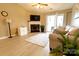 Inviting living room features a fireplace, comfortable seating, and access to the outdoor patio at 11867 Ridgeway Park Dr, Charlotte, NC 28277