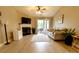 Inviting living room features a fireplace, comfortable seating, and access to the outdoor patio at 11867 Ridgeway Park Dr, Charlotte, NC 28277