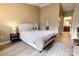 Comfortable main bedroom suite with a neutral color palette, ensuite bathroom and modern flooring at 11867 Ridgeway Park Dr, Charlotte, NC 28277