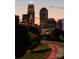Charlotte skyline at dusk with vibrant lights and visible landmarks, creating a captivating view at 121 Verbena Ne St # 14, Charlotte, NC 28217
