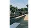 Outdoor view of a public transit station, showing platform, tracks, and overhead lines at 121 Verbena Ne St # 14, Charlotte, NC 28217
