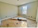 An empty bedroom with natural light and a clean, minimalist design at 1229 Rocky Face Church Rd, Taylorsville, NC 28681