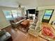 Cozy living room with a brick fireplace, ceiling fan and comfortable seating at 1229 Rocky Face Church Rd, Taylorsville, NC 28681