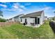 A fenced backyard offers a patio, grill, and ample green space at 139 Batten Ridge Dr, Statesville, NC 28677