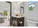Bright bathroom with a white vanity, neutral walls, a view to the main bedroom, and modern fixtures at 139 Batten Ridge Dr, Statesville, NC 28677