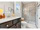 Stylish bathroom featuring a sleek vanity, a modern shower with glass door, and elegant fixtures at 139 Batten Ridge Dr, Statesville, NC 28677