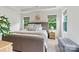 Serene bedroom featuring a neutral color palette, plush bedding, and ample natural light from large windows at 139 Batten Ridge Dr, Statesville, NC 28677