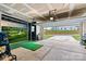 Spacious garage with golf simulator, providing a fun and practical space for recreation and storage at 139 Batten Ridge Dr, Statesville, NC 28677