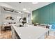 Open kitchen featuring a spacious island, modern appliances, open layout, and coffered ceilings at 139 Batten Ridge Dr, Statesville, NC 28677