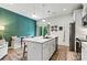 Modern kitchen island featuring white cabinets, an open layout, and stainless steel appliances at 139 Batten Ridge Dr, Statesville, NC 28677