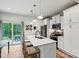 Stylish kitchen featuring modern appliances, white cabinetry, and opens to the outdoor patio at 139 Batten Ridge Dr, Statesville, NC 28677