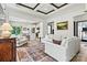 Bright living room featuring stylish decor, open to kitchen and light wood flooring at 139 Batten Ridge Dr, Statesville, NC 28677