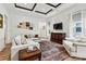 Comfortable living room with a coffered ceiling, and light wood flooring at 139 Batten Ridge Dr, Statesville, NC 28677