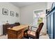Well-lit office featuring a wooden desk, a comfortable leather chair, and tasteful decorations at 139 Batten Ridge Dr, Statesville, NC 28677