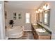 Bathroom with separate tub and double sink vanity for a luxurious and comfortable experience at 14335 Saint Johns Dr # 83, Stanfield, NC 28163