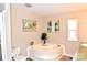 Bathroom with a soaking tub offers relaxation and complements the room's nautical decorative theme at 14335 Saint Johns Dr # 83, Stanfield, NC 28163