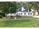Inviting home with manicured front yard, brick foundation, complemented by mature trees at 14335 Saint Johns Dr # 83, Stanfield, NC 28163